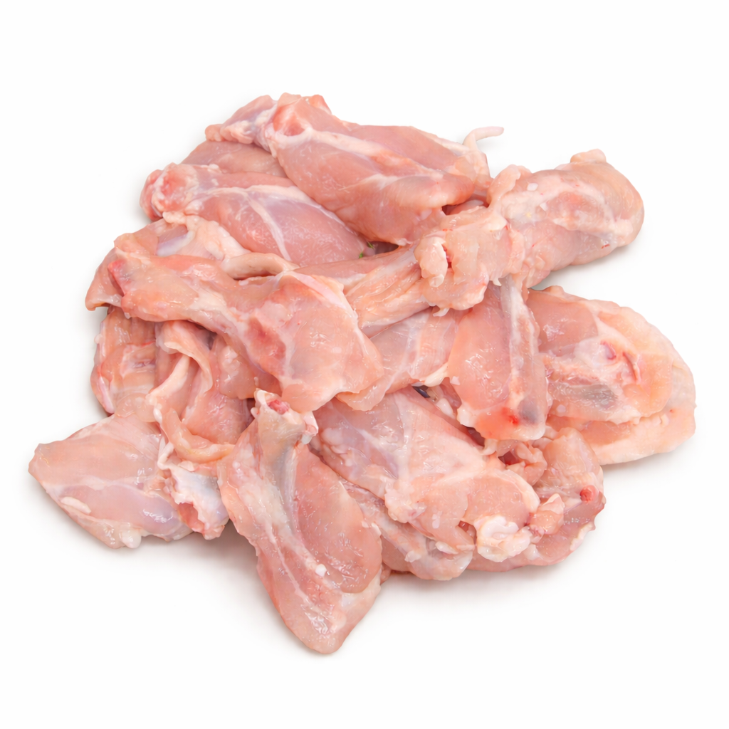 Raw chicken pieces on a white background