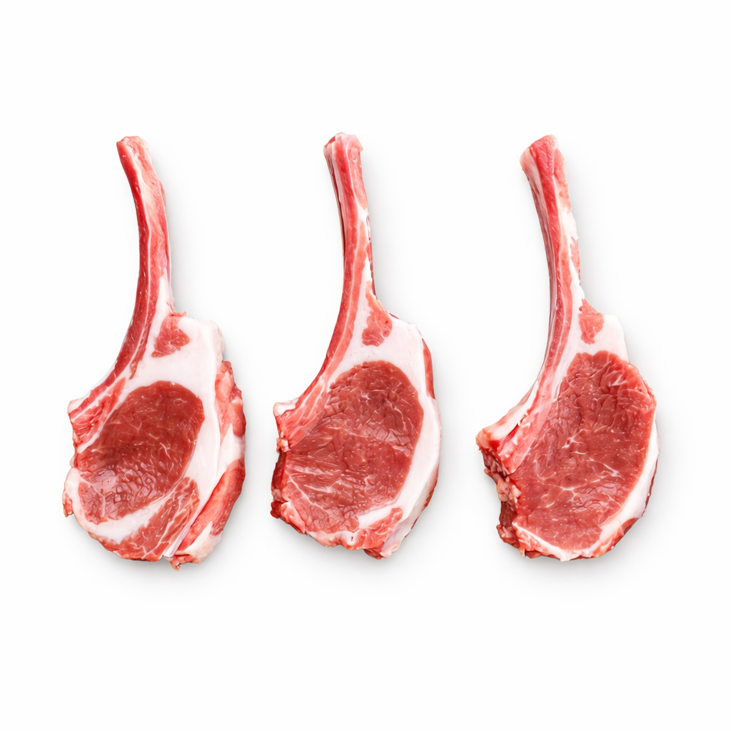 Three raw lamb chops on a white background