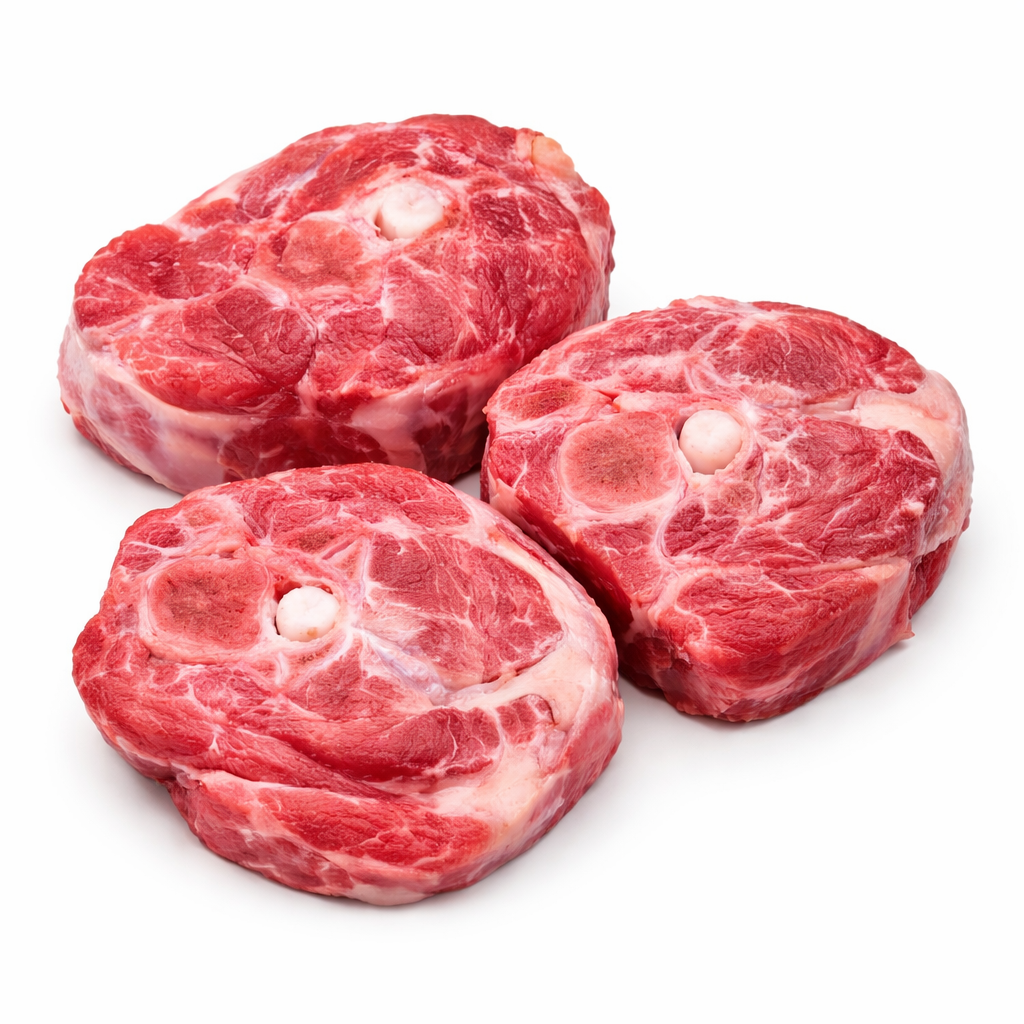 Three raw beef steaks on a white background